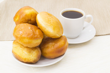 Cup of coffee and donuts