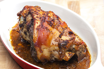 marinated, cooked and slowly baked pork knee