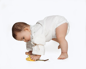 toddler learning to walk isolated on white