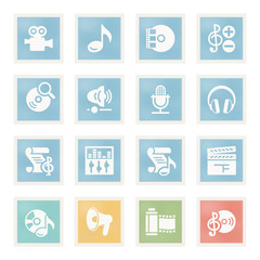 Audio video icons on paper.