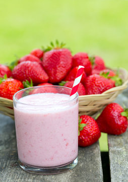 strawberry milk shake on wooden garden table