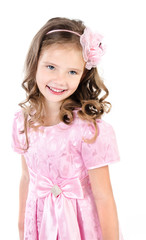 Adorable smiling little girl in pink princess dress