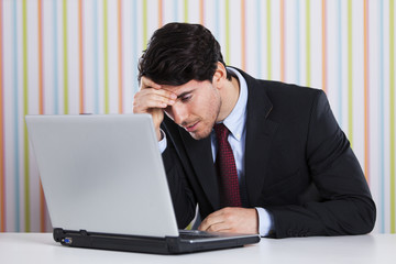 Businessman working at his laptop