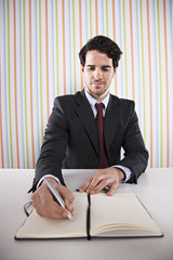 Businessman writing documents