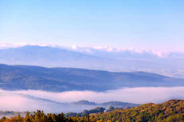 Fototapeta na wymiar Morning fog over hills of Tuscany