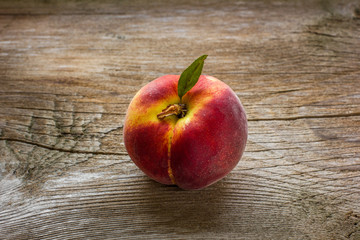 fresh peaches on wood background