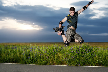 Roller skater jumping at the sunset