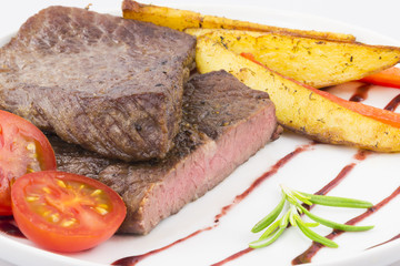 Beef steak with vegetables closeup