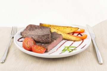 Beef steak with vegetables and cutlery