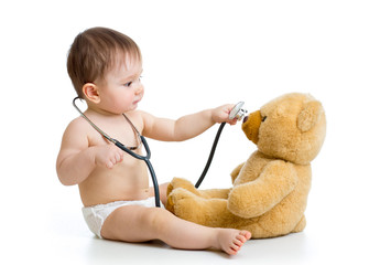 kid boy playing doctor with toy