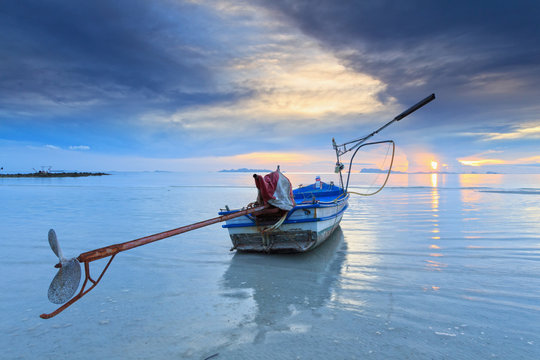 Sunset sea view with long tail boat.Long exposure technique