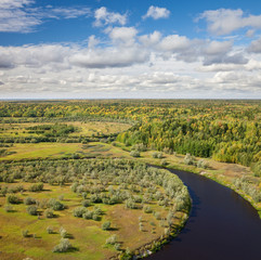Top view of the forest river in autumn