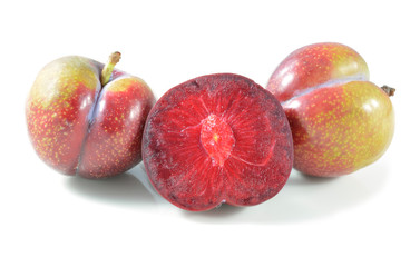 plums isolated on white