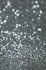 defocused abstract black silver lights background