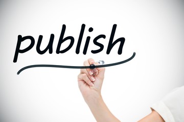 Businesswoman writing the word publish
