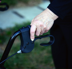Closeup midsection of a senior woman using walking frame