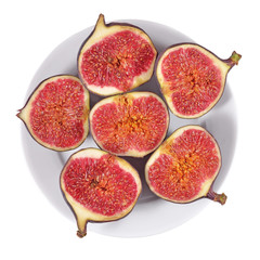 Fresh figs on a platе on a white