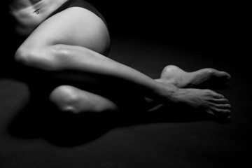 Fototapeta premium Legs and abdomen of a beautiful woman