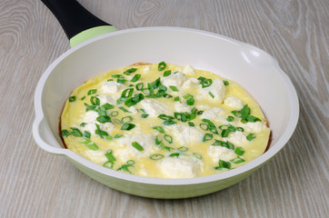 Omelet with feta cheese and green onions