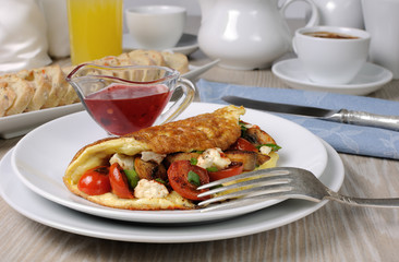 Omelette with cherry tomatoes, mushrooms and feta cheese