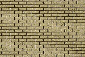 Fototapeta premium Wall made of decorative grey bricks with dark seams