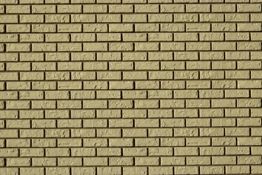 Fototapeta Wall made of decorative grey bricks with dark seams