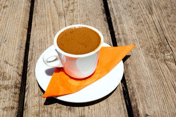 Coffee cup on wooden background