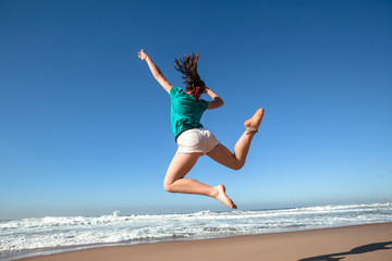 Girl Jumping Blue Beach Waves