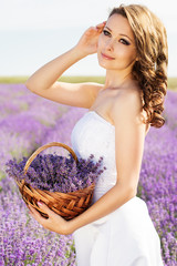 Beautiful bride posing at field of lavender
