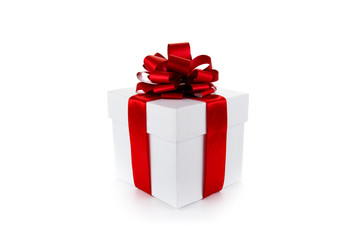 White gift box with red ribbon and bow