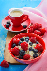 Fresh raspberries, blueberries and coffee