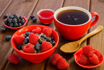 Fresh raspberries and blueberries on the curd