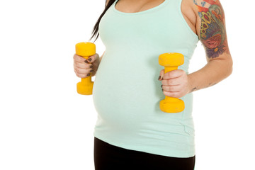 pregnant woman fitness blue weights by belly close