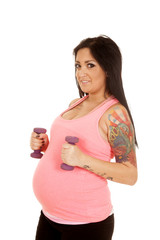 pregnant woman fitness pink purple weights by stomach