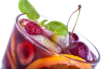 Sangria with citrus and other fruit on a white background