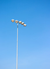 Spot light tower in blue sky