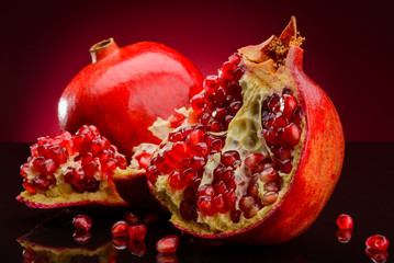 red pomegranate on dark background