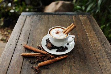 Composition with white cup of coffee