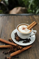 Composition with white cup of coffee