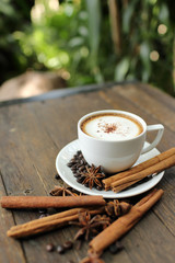Composition with white cup of coffee
