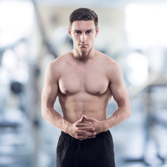 Fototapeta premium Portrait of an attractive athlete male trainer coach sportsman
