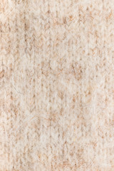 texture wool doggy knitted cloth as a background, closeup