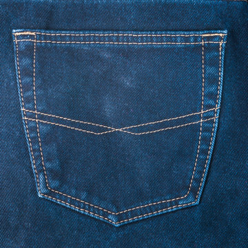 fragment of back pocket blue jeans, background