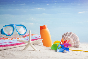 beach accessories, on blue sea background 