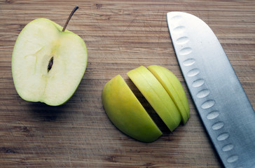 Large knife on a wooden board