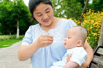 Oriental women in feeding babies