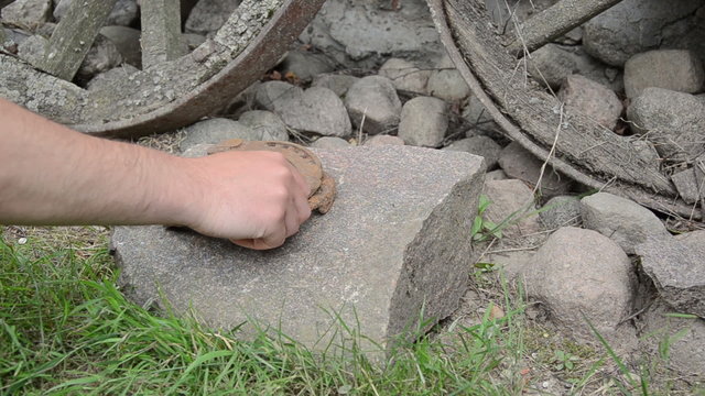 hand make stack of rusty retro horse shoes on stones