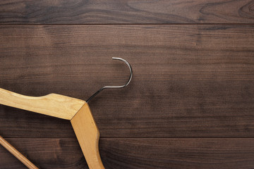clothing hanger on brown table