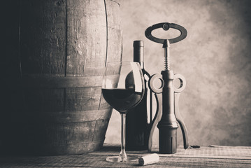 Fine wine glass bootle and barrel on wooden table Fine wine concept Wine tasting concept