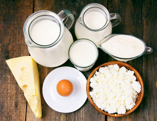 Dairy products on wooden background.